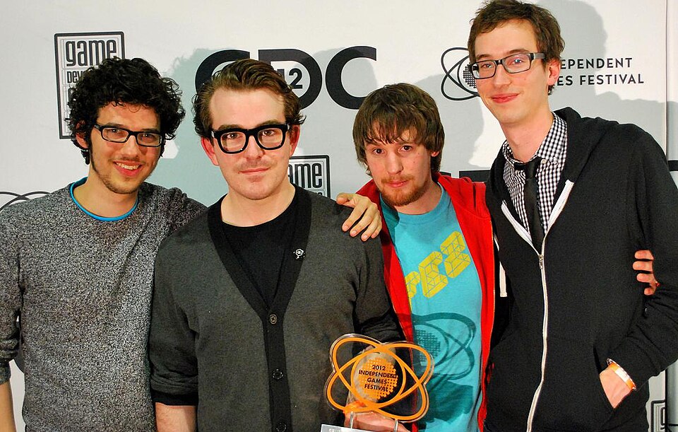 Four members of the Fez development team standing together at the 2012 Game Developers Conference