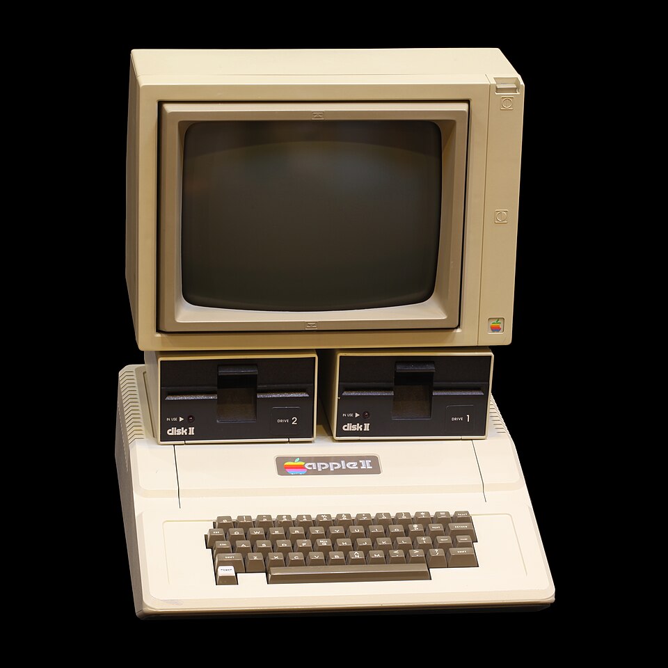 A beige Apple II computer with built-in keyboard.