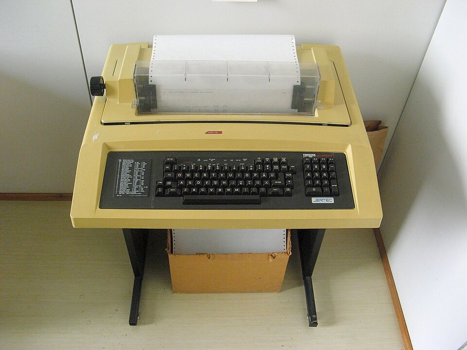 A Digital DECwriter teletype terminal with keyboard and paper feed.