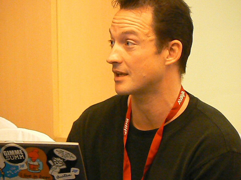Photograph of Chris Avellone speaking at an event