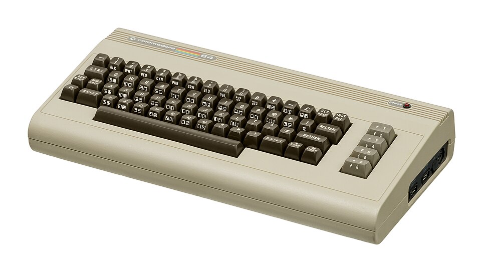 A beige wedge-shaped home computer with a full keyboard, the Commodore 64.