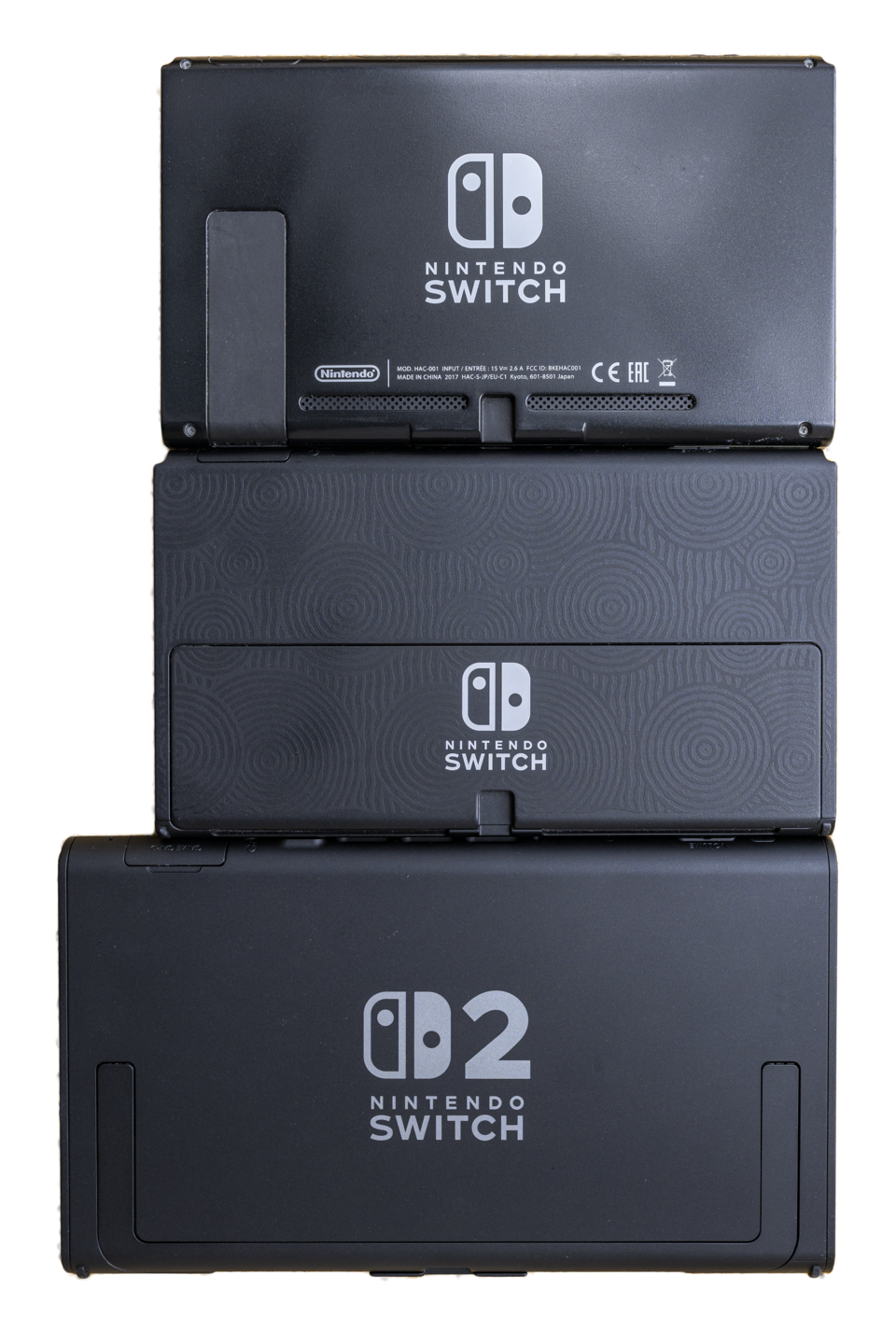 Three Nintendo consoles shown side by side, increasing in size from left to right