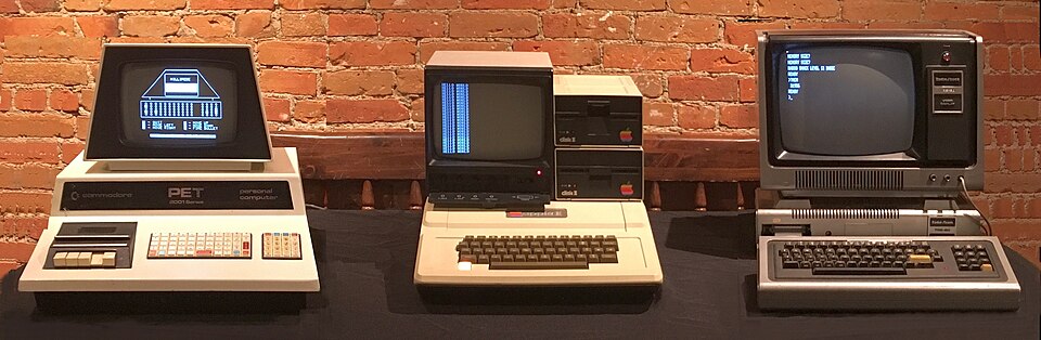 Three early home computers side by side.