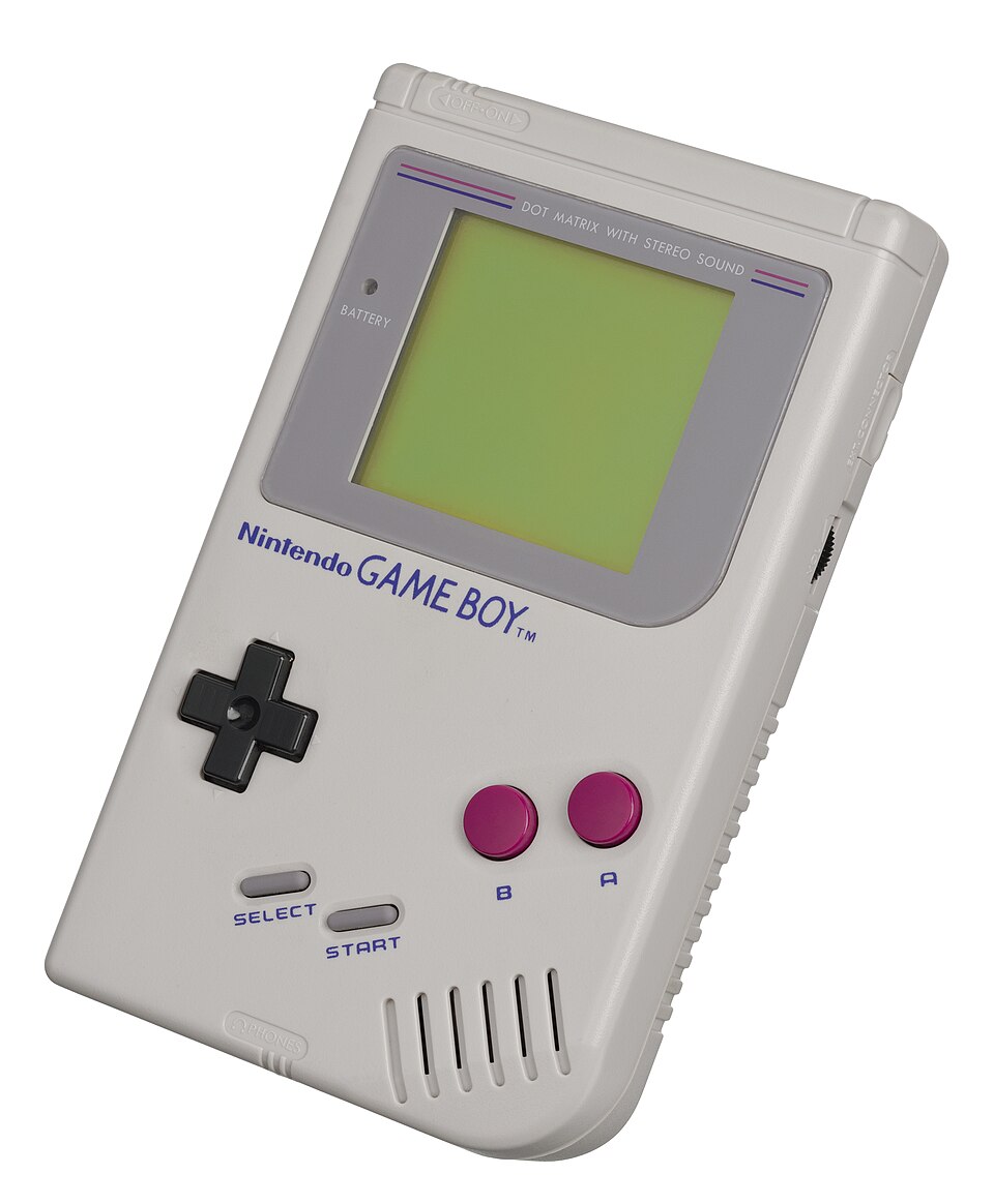 A gray handheld game console with a directional pad, two round action buttons, Start and Select buttons, and a green-tinted rectangular screen.