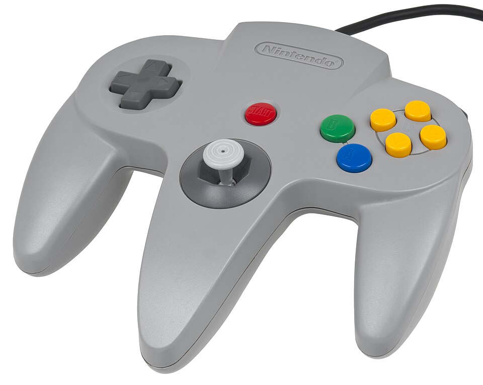 A grey three-pronged Nintendo 64 controller with a central joystick.