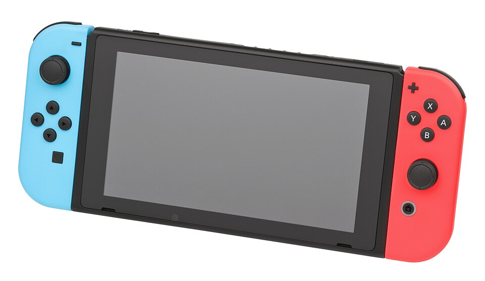A tablet-like game console held upright by a small stand, with a controller on each side.